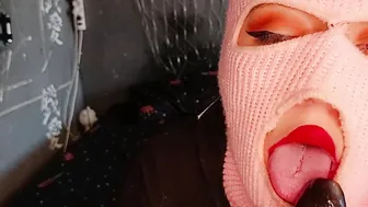 Babe Sucking Off off a Latex Penis
