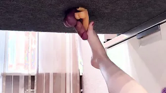 Jerking penis with goddess legs on the milking board