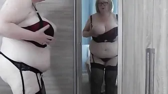 Sensual grandmother devil admires herself inside the mirror