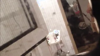 Window porn video – Window peeping dark hair with long jugs inside WC