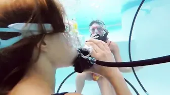 Katya Nakolkina with another chick inside the pool