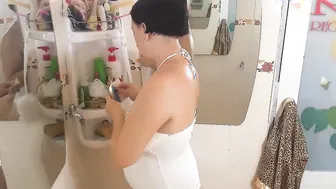 Nice Lady into the Shower Room Strokes Cosmetic Grind Lotion Oil on her Amazing Legs. Webcam one-two