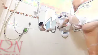 A delicious lady shaves her armpits into the shower room lathers her
