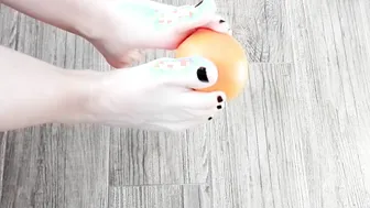 Small Foot Orange Squish between Sole. Play on Floor.
