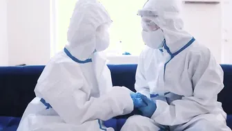 Lola and Lucky wearing protective gears while banging