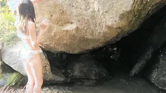 Slim dark hair into bikini walking Barefoot into nature and Smoking
