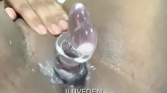 thick african fucks creamy twat with glass sex toy