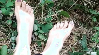 Showing off her tender foot and a pretty pedicure