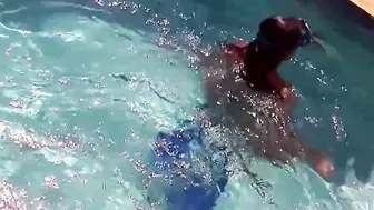 Hottie Candy swims and gets naked naked underwater