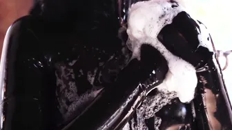 African rubber catsuit and soap suds