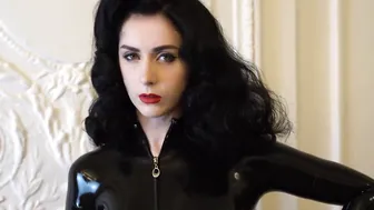 Trying on transparent pvc gloves on a catsuit