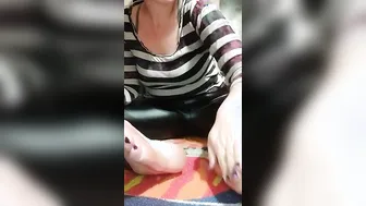 Ferralyn strokes coconut oil on her toes