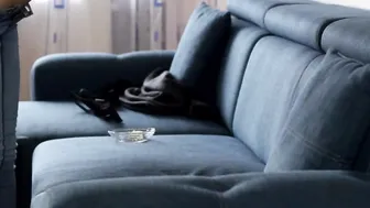 Smoking and masturbating on a couch