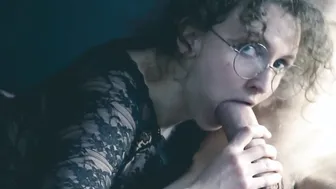 Curly haired women with glasses give nonchalant oral sex | Eye contact with camera