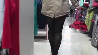 A concealed camera inside a fitting room spies on a bimbos with a crazy sexy booty and amazingly hot legs inside stockings.