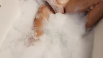 Big Boobed blonde 18 masturbates into the bath-tub
