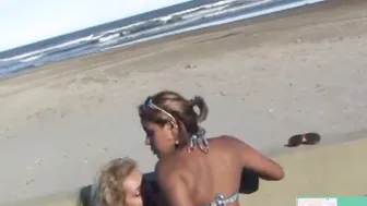 2 Girl blowing on a sandy beach. ( Full clip into 4kporn red )