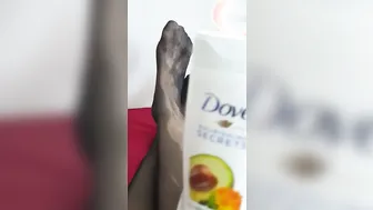 Babe foot into ebony stockings strokes with cosmetics - foundation deodorant and body milk