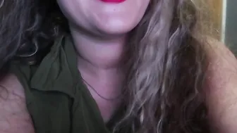 ADORABLE WOMAN PAINTS HER LIPS RED AND SMOKES a CIGARETTE