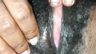 Black milf plays with her unshaved little snatch