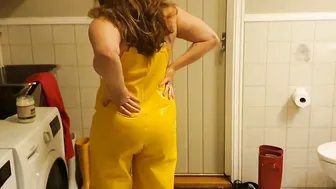 Greasing up huge boobies inside oil into rainpants and pvc boots