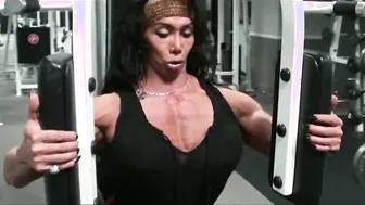 Long Breasted FBB Performs Pec Deck Muscle Explosion inside Gym