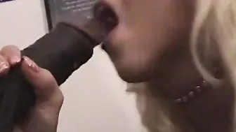 Blonde women getting on her knees to suck a african