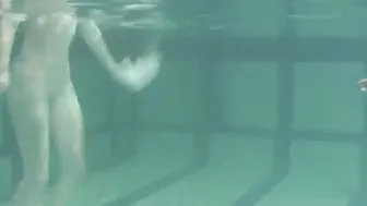 Russian dyke girls swimming inside the pool