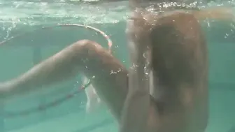 Russian dyke girls swimming inside the pool