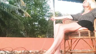 Beauty Blonde Smoking Cigarette on Terrace