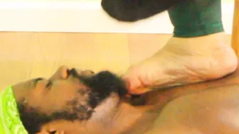 African goddess Toes smothers Slaves face