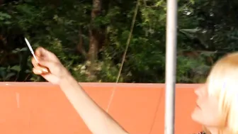 Real Amateur Blonde Smoking Cigarette On Roof Top