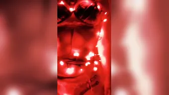 Claudia putting Christmas lights on new goddess outfit