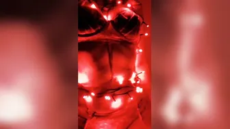 Claudia putting Christmas lights on new goddess outfit