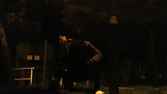 She drinks piss and cum inside a outside park while traffic passes