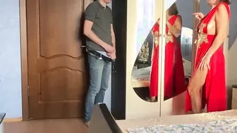 beauty sex of a Hot cougar inside a red dress before the New Years corporate party