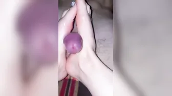 She jerked off with her legs and hands until her cum splattered.