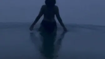 Hispanic cougar Takes an Evening Beach Stroll