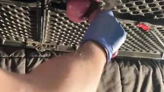 Milking table hand job with latex gloves.