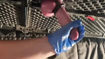 Milking table hand job with latex gloves.