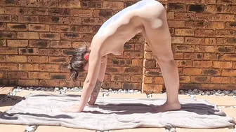 Sun porn video – Inked dark hair doing stretches outdoors into the sun while being completely nude