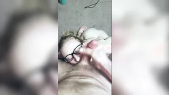 Slutty Blonde blows penis with glasses