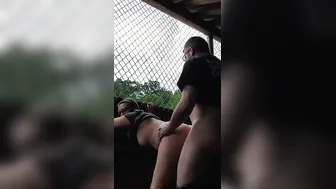 Risky public fucking into a baseball dugout.