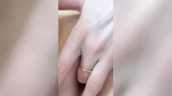 Masturbates her vagina. Close-up.