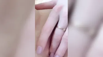Masturbates her vagina. Close-up.