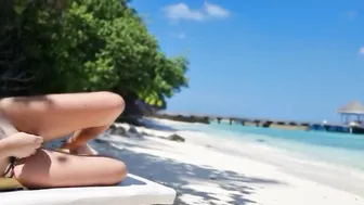Without underwear on Beach babe touching twat