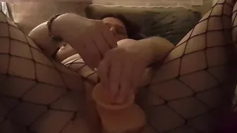 Fucking myself rough with toy wearing fishnets and squirt over the bed