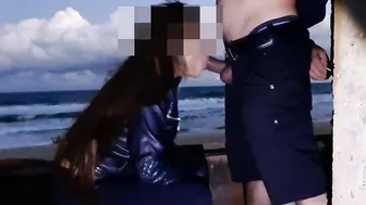 Prostitute on the beach serving a client into the afternoon