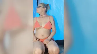 Camping Milf into orange bikini