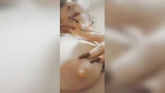 chick with gigantic boobs smokes a cigarette